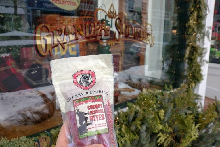 A Bag Of Cherry Republic Licorice Bites Held Up In Front Of The Grandpa Shorter's Display Window In Downtown Petoskey, Michigan