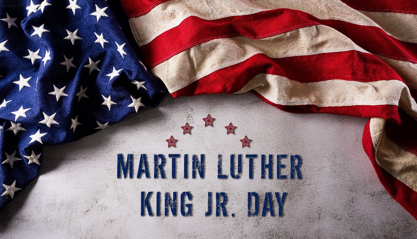 Martin Luther King Day Anniversary Concept. American Flag Against Dark Stone Background