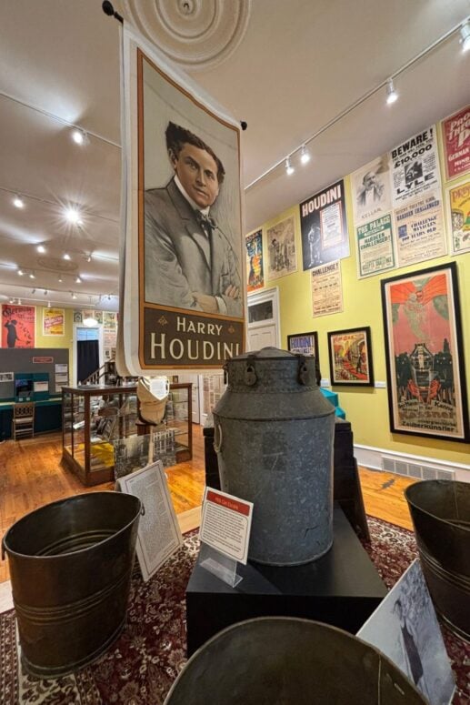 Harry Houdini Posters And Large Milk Cans On Display At The American Museum Of Magic.