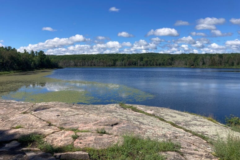 Still Lake With Blue Skies Overhead