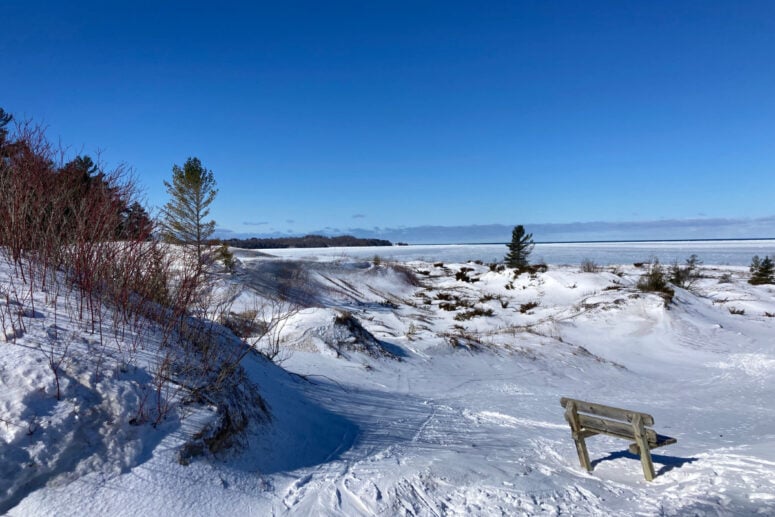 A Winter Scene With Snow Covering The Sand Dunes.
