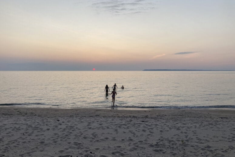 People Swimming In Calm Water.